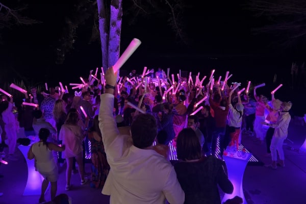 People dancing with glow sticks